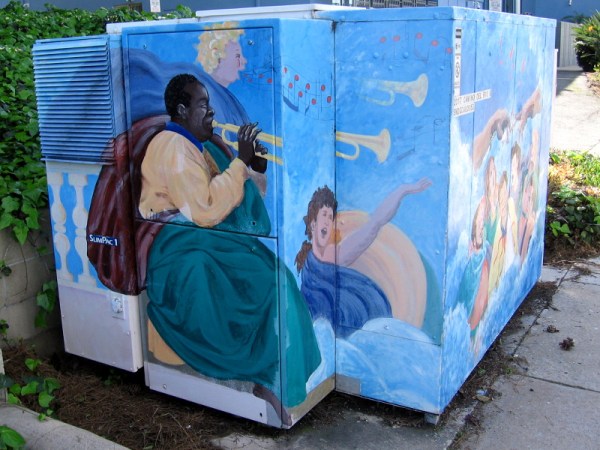 Louis Armstrong plays his trumpet in heaven with an angel nearby. Some colorful street art painted on a large electrical box on Camino del Rio South in Mission Valley.