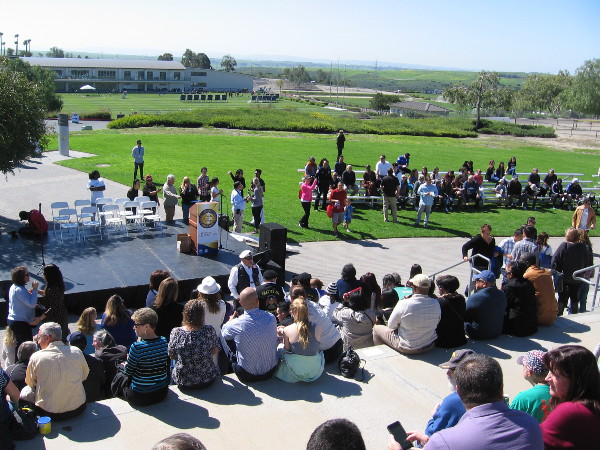 Everyone prepares for the ceremony, which will also honor local champions! Those are the champions assembled to the right!