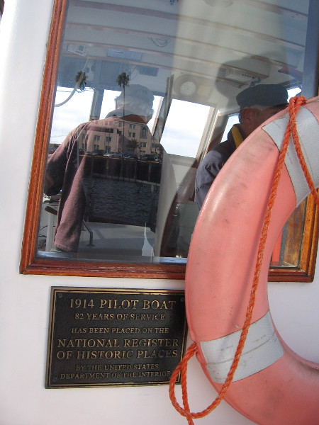 A plaque indicates the 1914 Pilot Boat has 82 years of service and has been placed on the National Register of Historic Places.