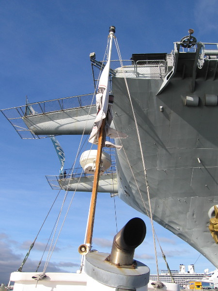This harbor tour is going fast! We're already passing under the immense bow of the USS Midway aircraft carrier museum.