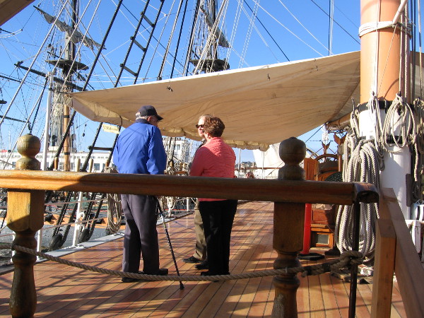 Folks enjoy a sunny San Diego day on the newly restored poop deck of the historic tall ship Star of India.
