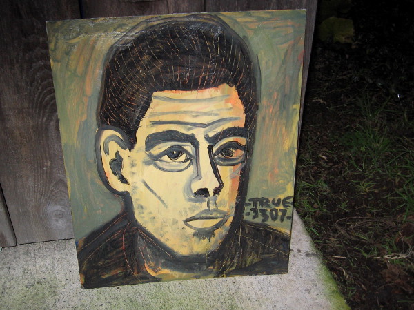 Cool painting of male face found leaning up against a dumpster enclosure on Cortez Hill.