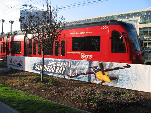 San Diego Trolley leaves the Gaslamp Station and passes a new banner advertising the Red Bull Air Race in mid-April.