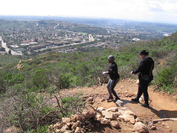 Hikers descend from the summit of Cowles Mountain, which rises above San Diego's San Carlos neighborhood.