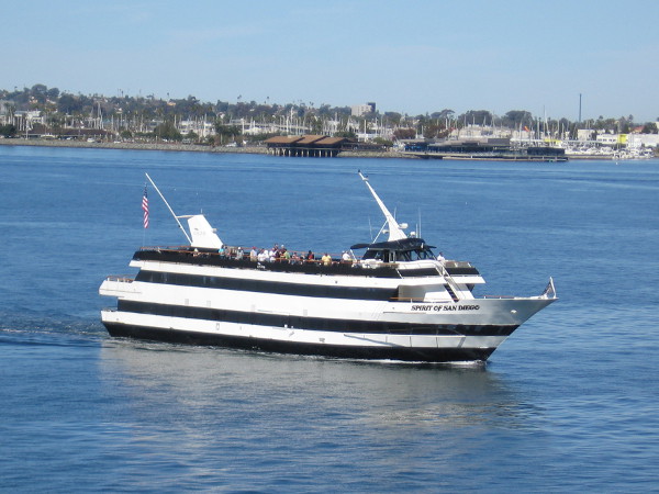 And here comes the Spirit of San Diego right behind! Now I'm standing at the end of one horn, which hangs high over the blue water below!