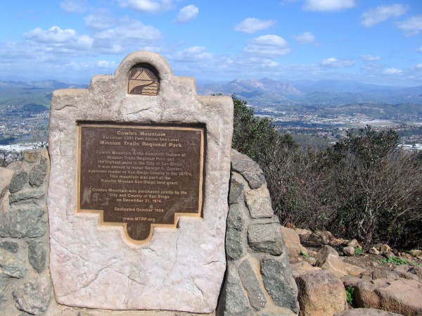 Plaque at the summit. Cowles Mountain is the dominant feature of Mission Trails Regional Park. It was named to honor George A. Cowles, a pioneer leader of San Diego County in the 1870's.