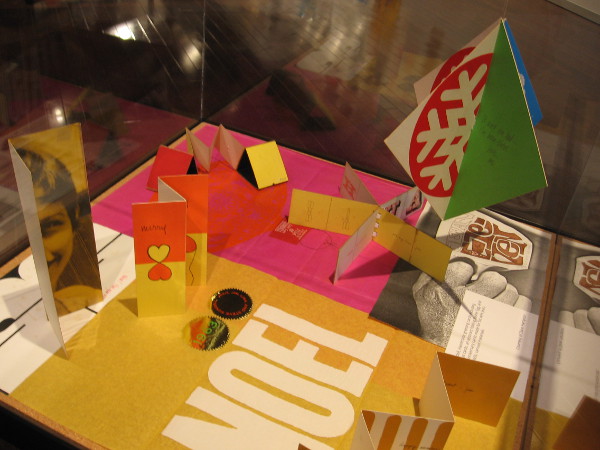 A display case in the Central Library's gallery contains more unique examples of printed art.