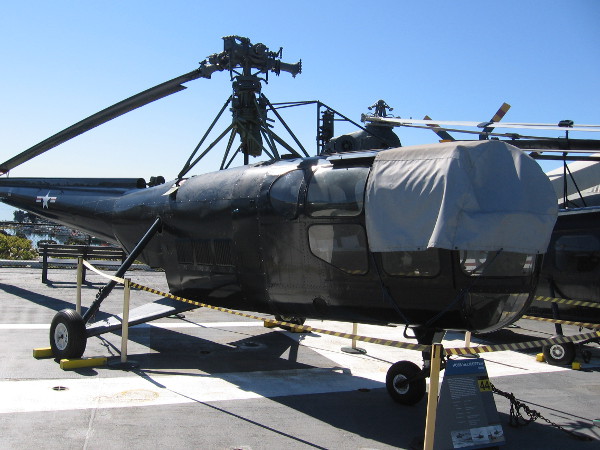 Here's the HO3S-1 Dragonfly helicopter up on the flight deck of USS Midway. Notice three of four rotors are missing.