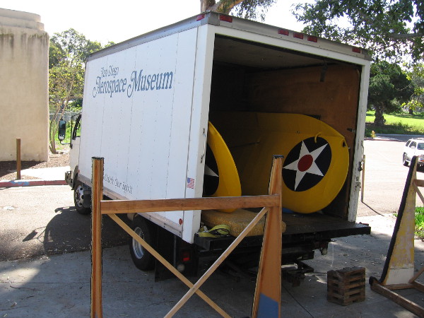 These yellow wings in the San Diego Air and Space Museum truck are heading to Gillespie Field in East County. They are part of a PT-22 airplane.
