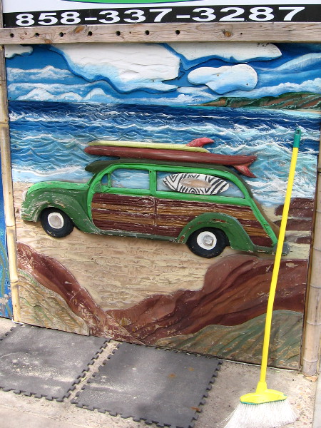 Another cool woodie with surfboards on the roof.