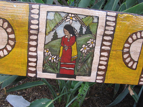 Benches facing the stage include bits of cheerful folk art.