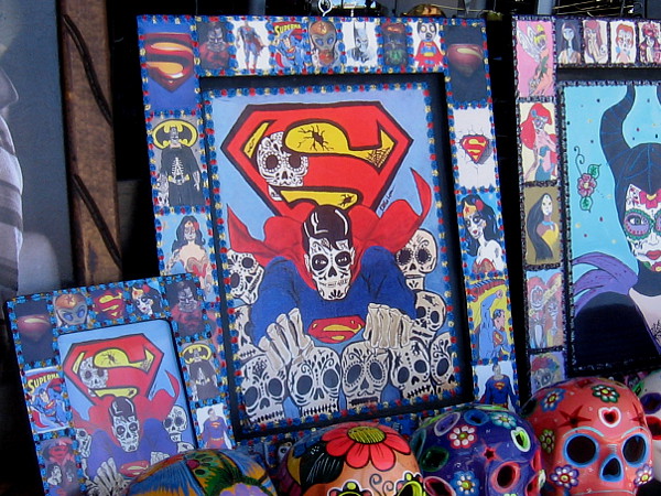 A skeletal Superman flying through skulls.