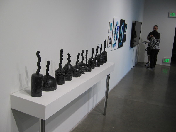 Works of human imagination along one wall.