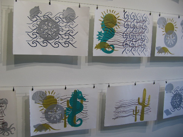 The serigraphs on this wall were made by students in the SDSU Graphic Design program. Imagery depicts ocean and desert ecosystems as migratory environments.