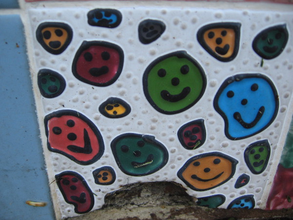 Lots more smiley faces! They almost look like leaves to me.