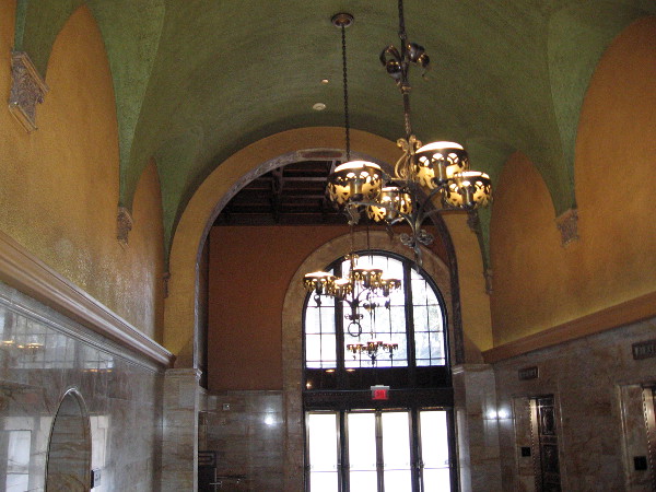The beautiful arched ceiling near the bank of elevators.