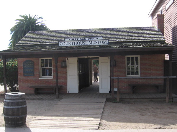 Photo of the modest brick First San Diego Courthouse Museum in Old Town, a recreation of the city's first courthouse.