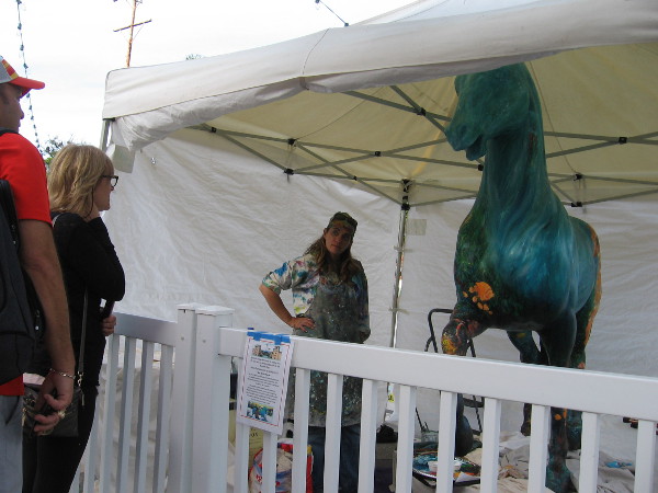 Artist in Balboa Park's Spanish Village tells visitors about her very unique work of art.