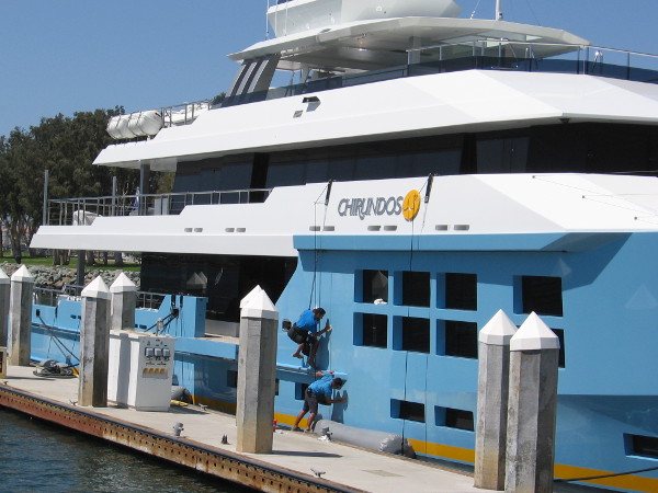 These poor guys had to work during the big event. Superyachts docked behind the convention center need constant maintenance!