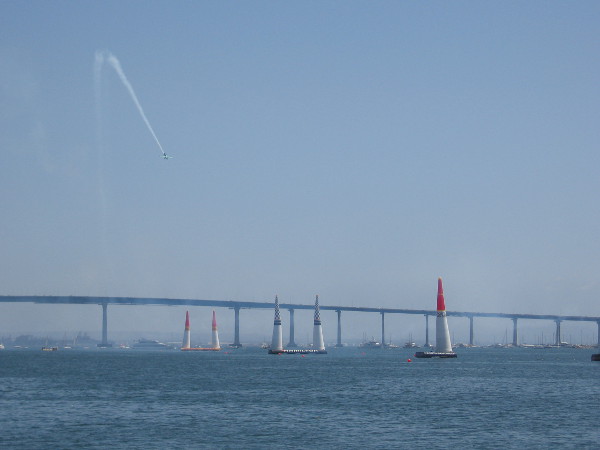 The Red Bull Air Race has resumed! A pilot descends toward the starting pylons!