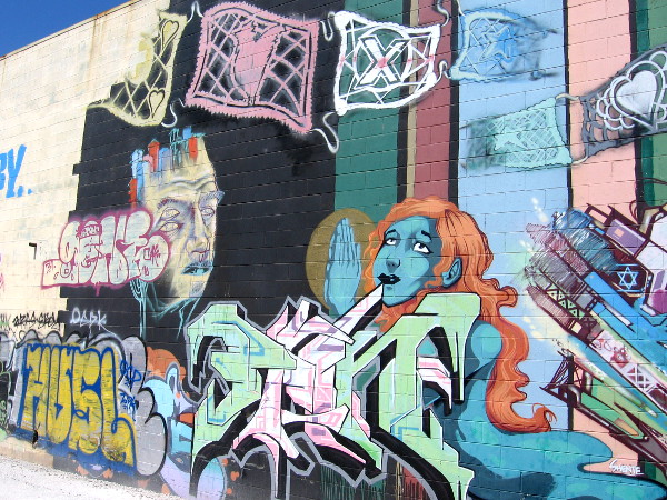 A beautiful blue face and symbols on Mexican papel picado.