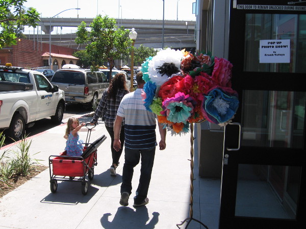 A family heads toward Chicano Park, where a big annual celebration of Latino history and culture took place today.