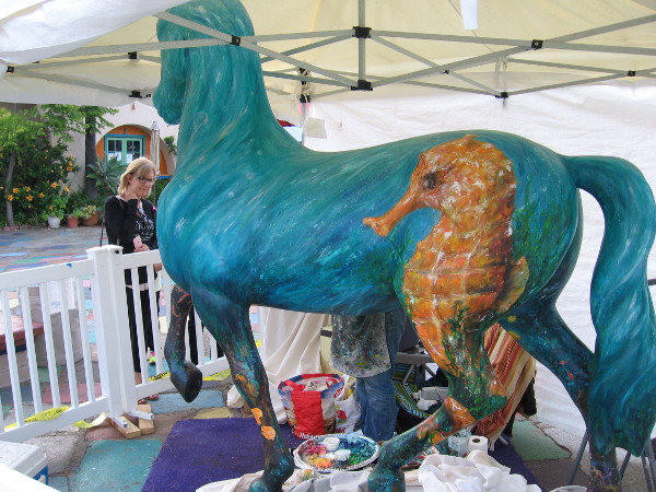 A large seahorse on a horse named Sea Biscuit. The famous Sea Biscuit ran a legendary race at Del Mar in 1938.