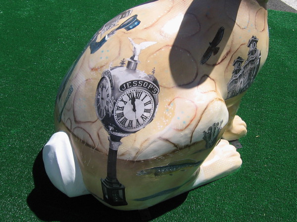 In this photo I see the Jessop's Street Clock and the Louis Bank of Commerce Building!