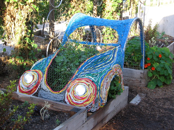 This super cool car made of colorful wires recently appeared at The Garden Project of the New Children's Museum.