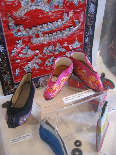 Colorful woven art, and Chinese shoes and slippers for bound feet.