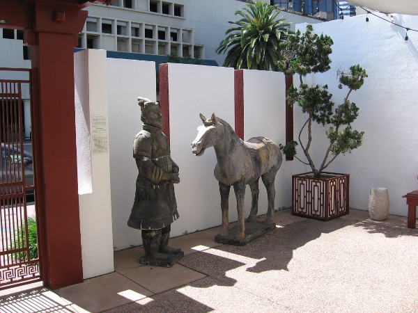 Terracotta horse and general are replicas from the Terracotta Army unearthed at Xian, China. They occupy a corner of the museum's outdoor Chuang Garden.