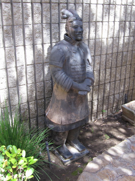 Another warrior statue in the cool shade.