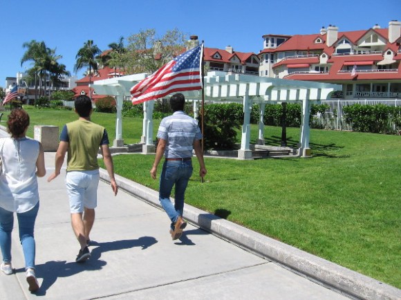 Walking west through Centennial Park. Flags line the pathway for the upcoming Memorial Day weekend.