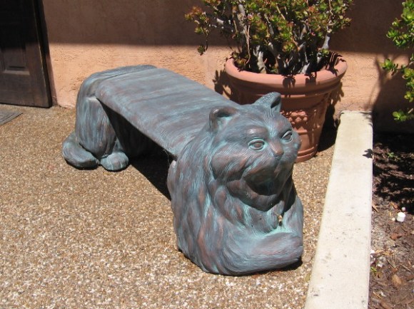 A cool cat bench outside the entrance of the Coronado Veterinary Hospital.