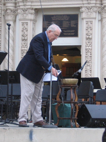 Art Stillwell of the San Diego Kiwanis Club remembers benefactor Bill Gibbs by ringing a Tibetan singing bowl.