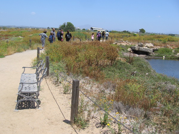 As the group continues on, I linger to take in the sunshine and wide views. I notice what appears to be remnants of the potash manufacturing operation from years ago.