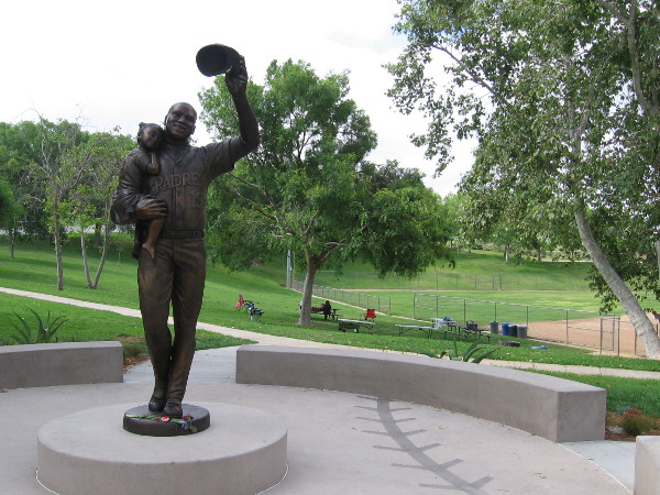 The beautiful bronze sculpture celebrates one of the greatest hitters in MLB baseball. Gwynn doffs his cap while carrying his daughter Anisha.