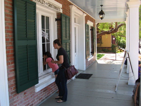 Visitors to Old Town San Diego peer into the Whaley House window just left of the front door. That is where the Whaley and Crosthwaite General Store was located.