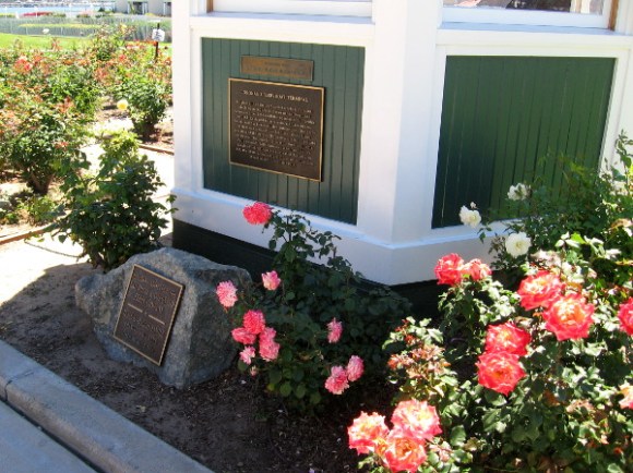 Roses bloom near the old ticket booth of the original Coronado ferry.