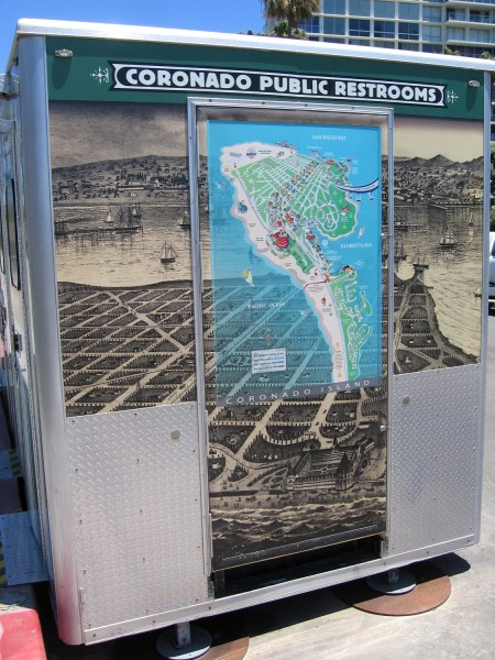 Old and new maps of Coronado Island on a portable restroom.