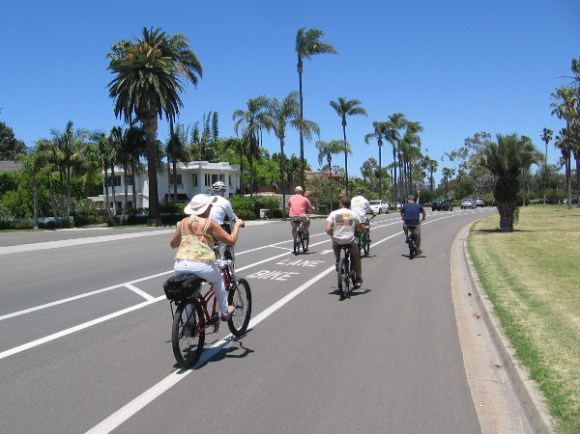 Bicyclists ride down Glorietta Boulevard, part of the Bayshore Bikeway around San Diego Bay.