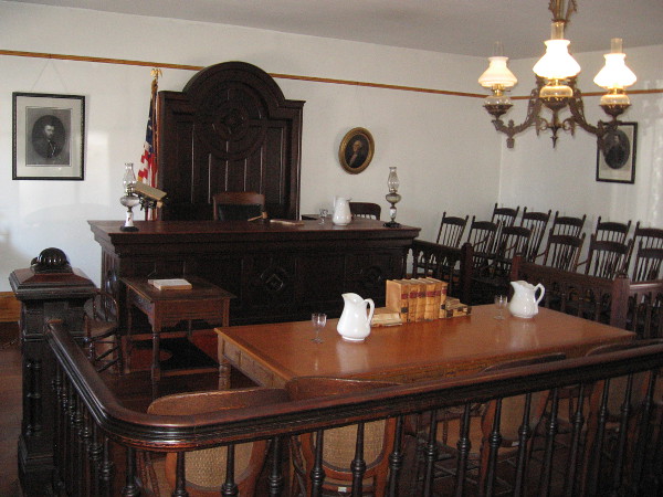 The self-guided tour begins in the courtroom, behind the store. Originally a granary whose brick walls didn't stop rats, at different times the room served as school, church, ballroom and billiard hall.