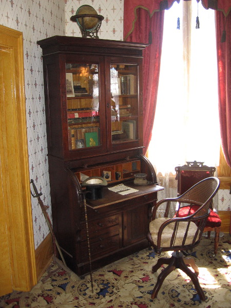 The adjacent study with desk and bookcase. During his time in San Diego, Thomas Whaley held many positions, including merchant, city clerk, notary public, realtor and railroad secretary. That sword was actually a prop used by the Tanner Troupe during their performances in the theater upstairs.