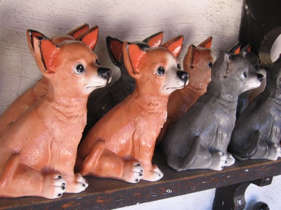 Pottery pooches on a shop's shelf in Old Town.