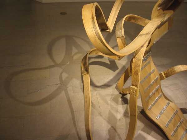 An intangible tangle of shadow on the floor seems to be an important part of the sculpture. The artist calls himself a fabricator.