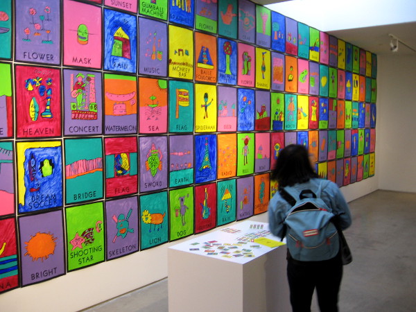 Visitor at San Diego Art Institute in Balboa Park checks out Loteria Reinvented!