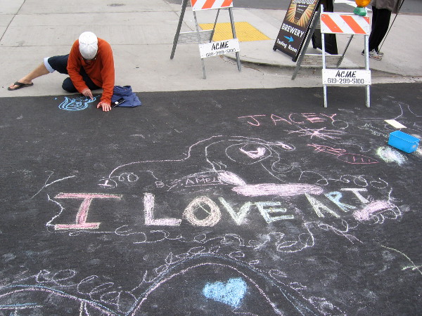 Someone tries their hand at creating with chalk during the Ocean Beach Street Fair. I Love Art.