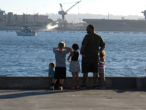 Eyes gaze with wonder across the water.