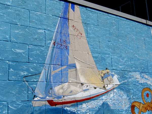 The beautiful mural shows sailboats racing on the blue ocean.