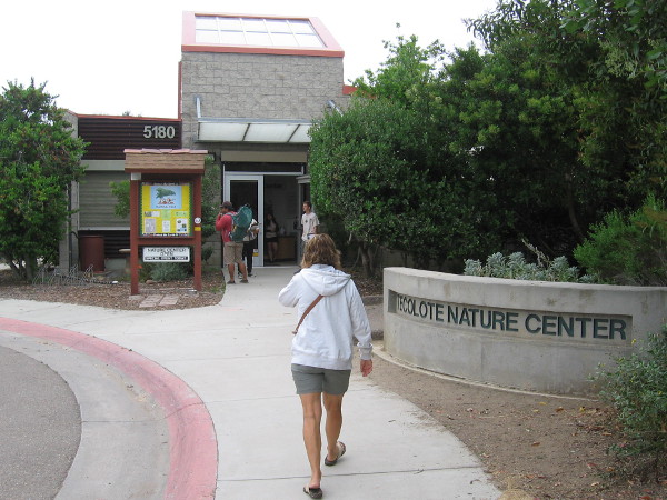 Someone walks toward the Nature Center on Tecolote Family Day.